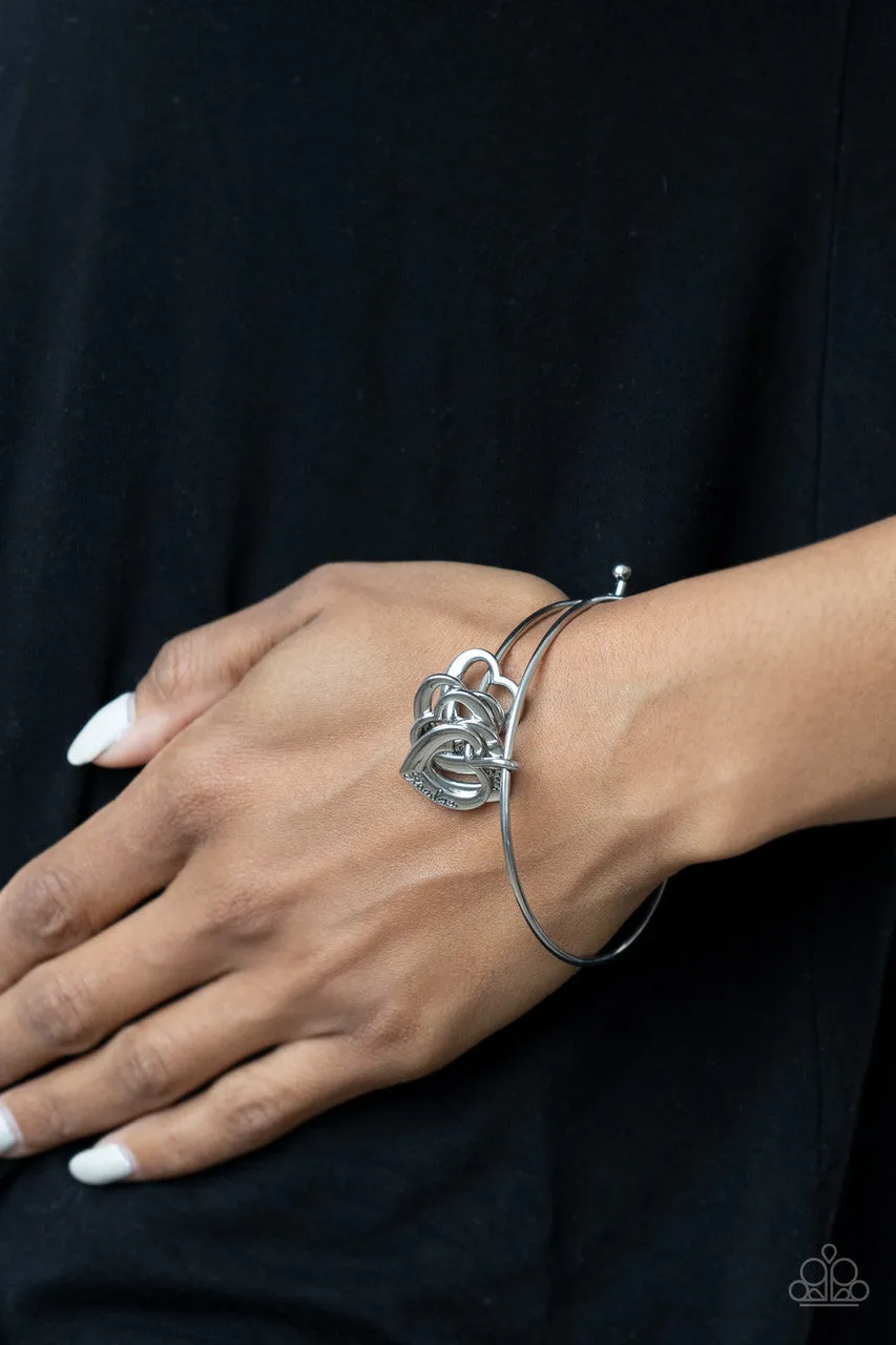 A Charmed Society Silver Paparazzi Bracelet
